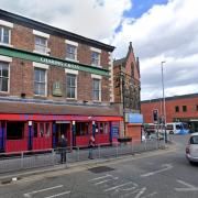 Arrest made after man found with head injury outside Birkenhead pub