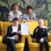 Left to right: West Kirby School and College’s Librarian Louise Russell with Patricia Abernethy (Learning Support Manager) and year seven pupils with Dyslexia Friendly Quality Mark certificate
