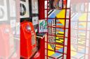 Artwork created by children at the Wirral school once attended by OMD's co-founders has gone on display in the phone box in which the band made its earlier gig bookings