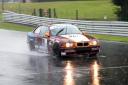 Darren Beckly racing his 1900 BMW 318is in very wet conditions at Oulton Park. Picture: Mike Lyne.