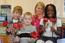 Pupills from Ladymount Primary with their poppies. Picture: Paul Heaps