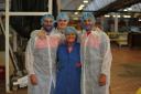 Tommy Makinson, Adam Swift and Jon Wilkin with factory worker Denise Millington