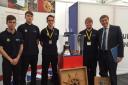 PICTURE: Some of the apprentice team with the HMS Liverpool bell and Philip Dunne MP at the event in London
