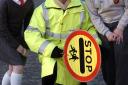 SAFETY FIRST: Lollipop lady Iris Harrison with Jake Williams, aged nine, and Grace Halliday, who is ten