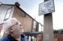 Sign out: Residents Alliance member Dave Rimmer inspects suspect parking notice