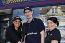 Tom Watson (centre) has managed  the William Hill shop in Hoylake since 2009.