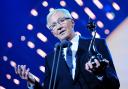 Paul O'Grady collecting the best Factual Entertainment programme award on stage during the 2014 National Television Awards at the O2 Arena, London.