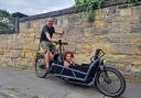 Ava, from Prenton, who attends Stick ‘n’ Step, enjoying a bike ride with her dad, Jon