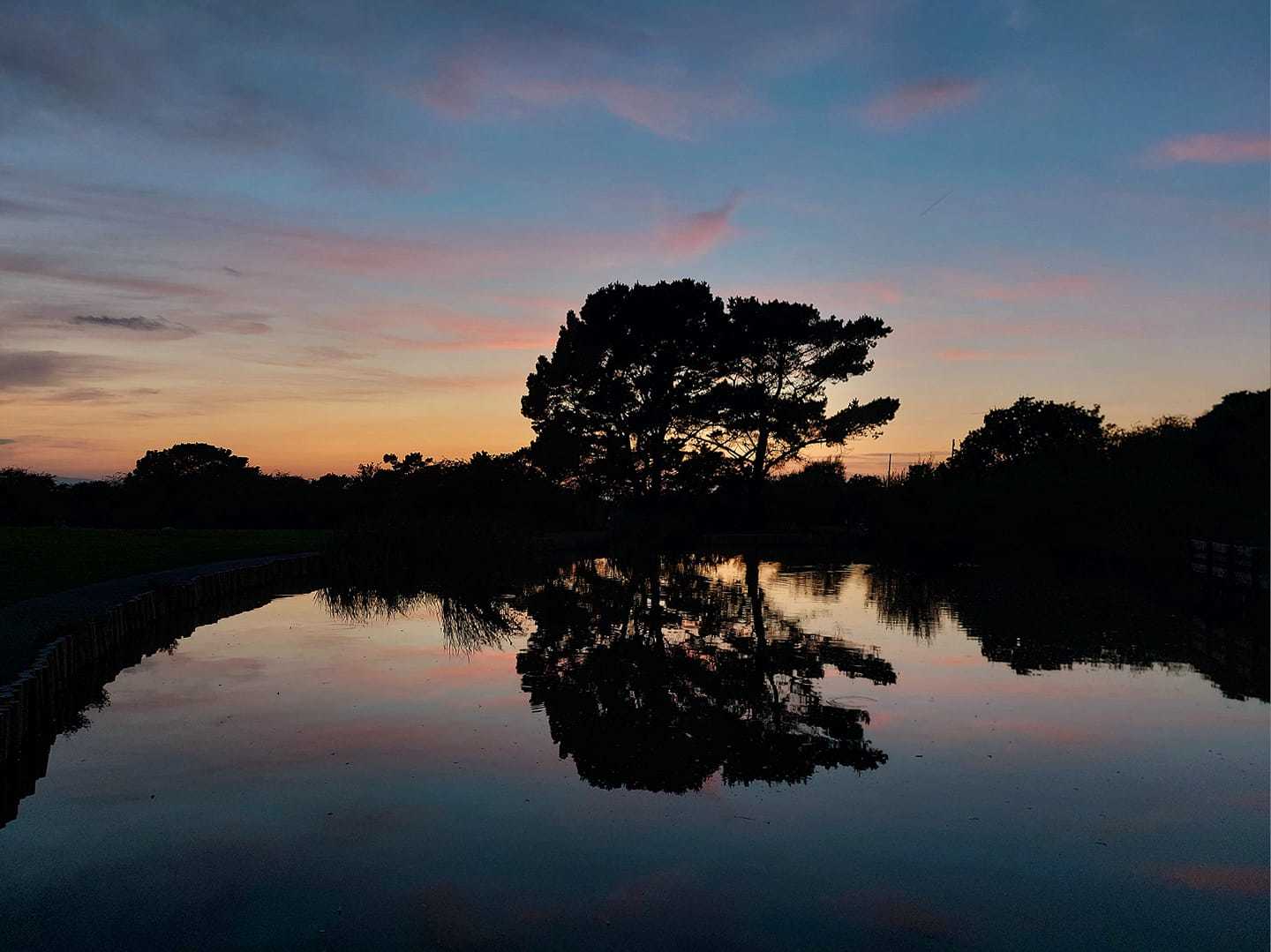 Reflections at sunset in Thurstaton by Helen Clough