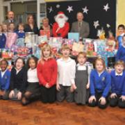 St George's Primary School pupils with the gifts they have collected