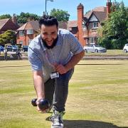 Refugee Rafiullah Enayet learns the art of crown green bowls during session in Port Sunlight. Picture: Craig Manning