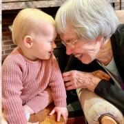 A baby group visit is among Caldy Manor care home's intergenerational playgroup activities