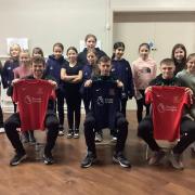 Tranmere Rovers gift football kits to girls at Wirral primary school