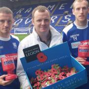 Rovers midfielders Jason Koumas and Marc Laird with Pete Dunning at the launch of Poppy Appeal at Prenton Park this morning. Picture: Craig Manning
