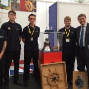 PICTURE: Some of the apprentice team with the HMS Liverpool bell and Philip Dunne MP at the event in London