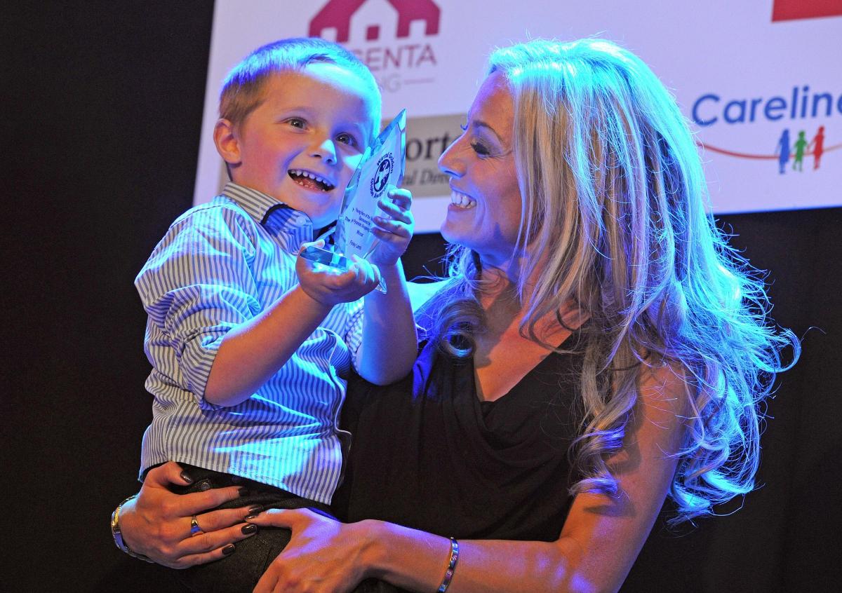 Wirral-based actress Suzanne Collins with Young Hero of the Year winner, Finley Lamb.