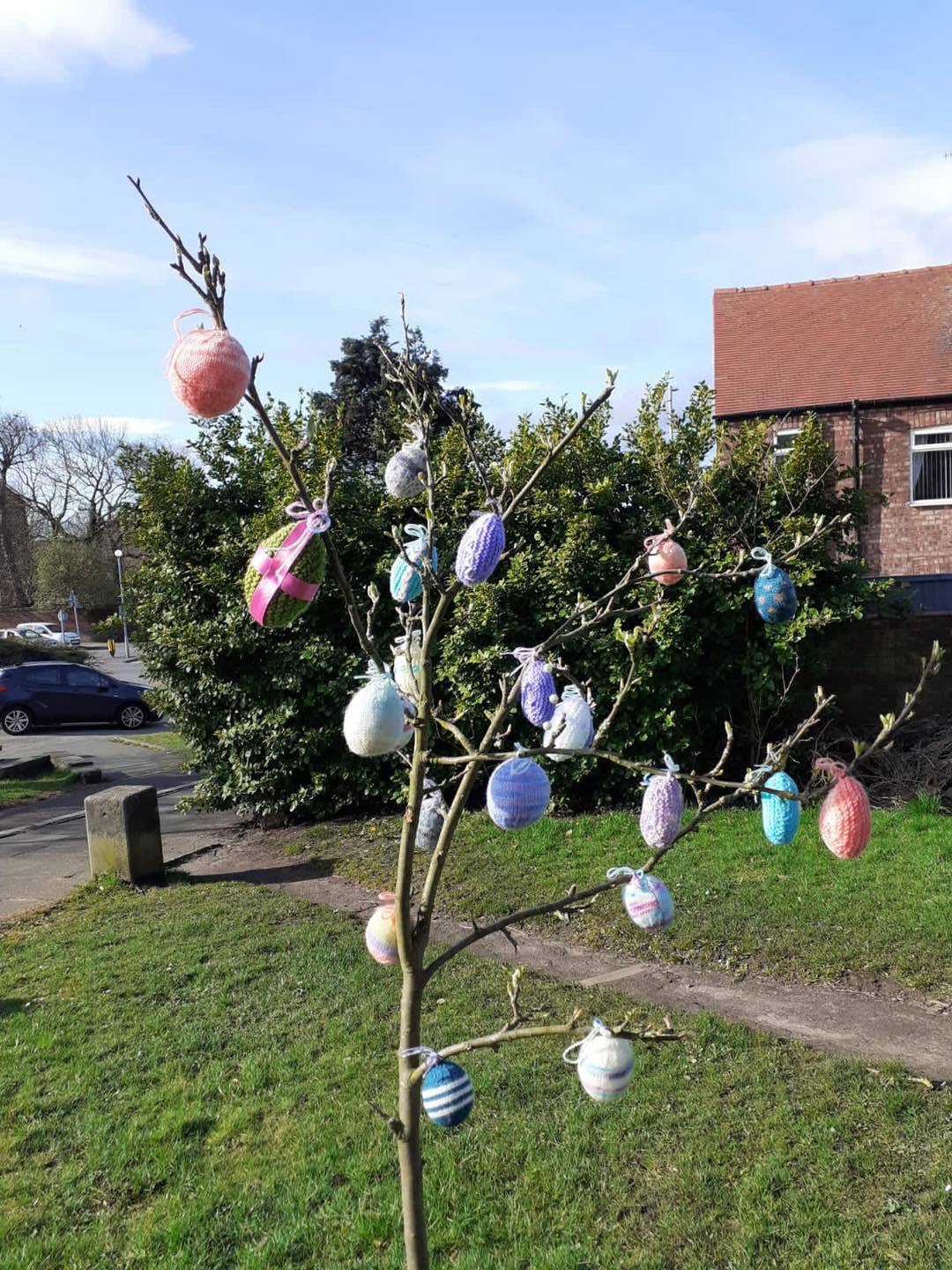Knitted easter eggs in tree