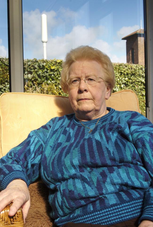 CONCERNED: Pensioner Joyce Johnson in her garden near to the disputed T-Mobile phone mast 