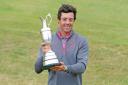 Rory McIlroy lifts the iconic Claret Jug at Hoylake in 2014.