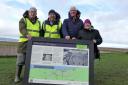 Members of the Parkgate Society with the board that will be situated at the Old Baths.