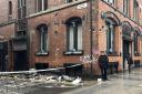 Police officers outside The Safehouse nightclub on Victoria Street in Liverpool. Three men have been injured after a 