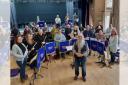 Heswall Concert Band with its conductor Greg Williams during rehearsal at Heswall Hall
