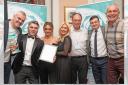 Staff from LMF Energy Services celebrate taking top award for the second consecutive year at the North-West of England Energy Efficiency Awards