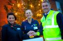 Spreading Christmas cheer at Arrowe Park Hospital: Kate Rigby, sales consultant Stewart Milne Homes, Laura Parker Ward manager and Colin Miller Site manager at Stewart Milne Homes switch on the lights