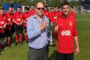 Simon Davies of Roodee Creative presents Tom Gerraghty Memorial Trophy to Newton Athletic Youth FC