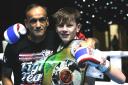 Joe Ryan is pictured with his dad and trainer Karl, after his world championship battle with Cypriot fighter Kyriakos