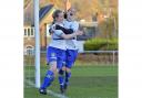 Laura Pennington (left) and Heather Ryan celebrate one of Tranmere’s 10 goals at Mossley Hill. Pic: Tony Coombes
