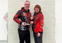 Tim Peers with his trophy at the Cheshire Archery Association championships, pictured with Karen Hamer, Wirral Archers’ Chair, and 2nd place winner of the Cheshire Ladies Longbow championship.
