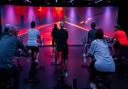 Immersive fitness studio at Bidston Sports and Activity Centre with a floor-to-ceiling screen  offers bicycle-led fitness classes