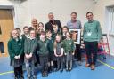 Andy McCluskey with pupils at Great Meols Primary School during - including the competition's winner - Winnifred Bates - during the special assembly on Tuesday, January 8. Their work will be on display in the red phone box over next 12 months