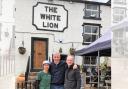 The White Lion’s owner Andy Cockram with Bamboo Thai's Dave Otter and Pam Anuniwat