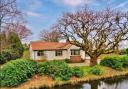 This bungalow in Gayton is described as 'deceptively spacious' with a delightful pond and Dee Estuary views. Pic: Move Residential / Zoopla