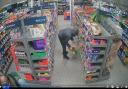 Footage from CCTV appears to show robbery underway at One Stop Shop on Laird Street in Birkenhead on Sunday night (April 7)