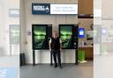 Mersey Ferry terminal staff member Rob Wynn shows off the new self-service kiosks