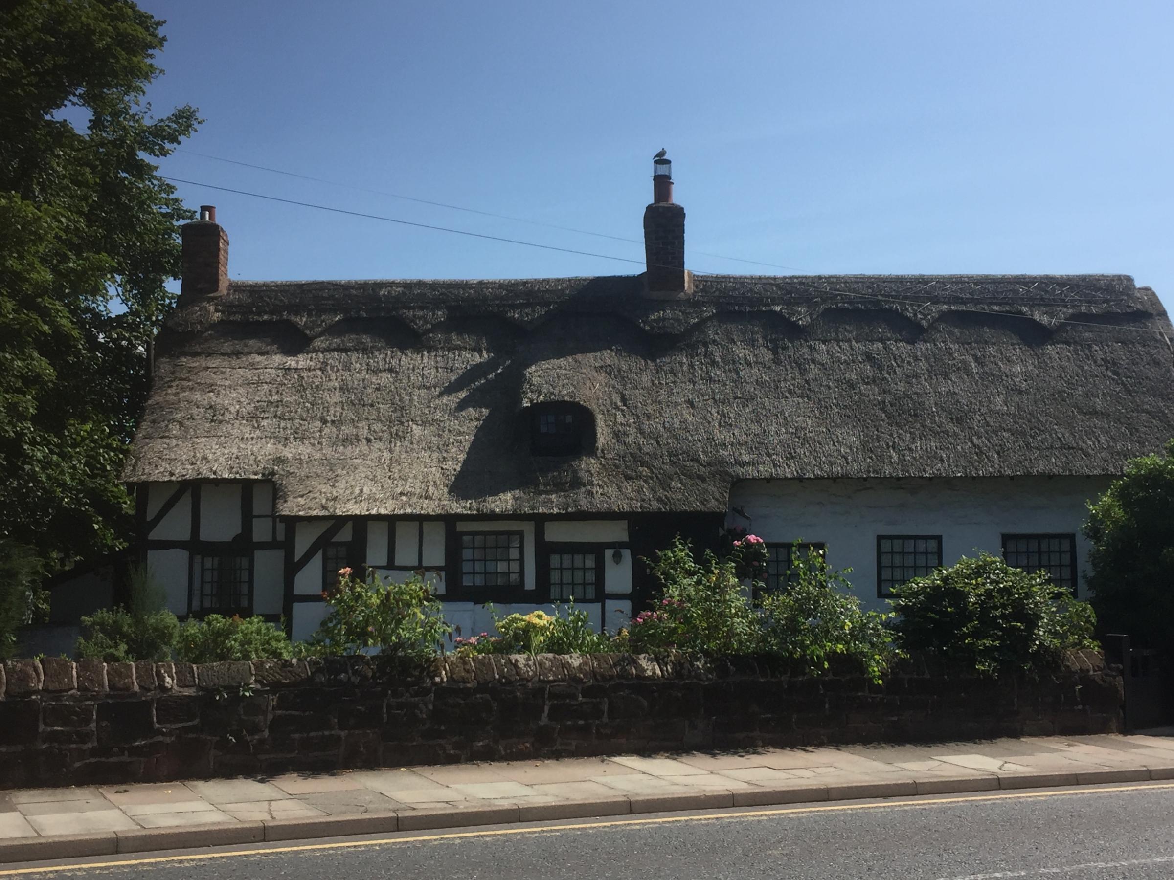 The beautiful thatched cottage in Bebington is still standing and lived in today