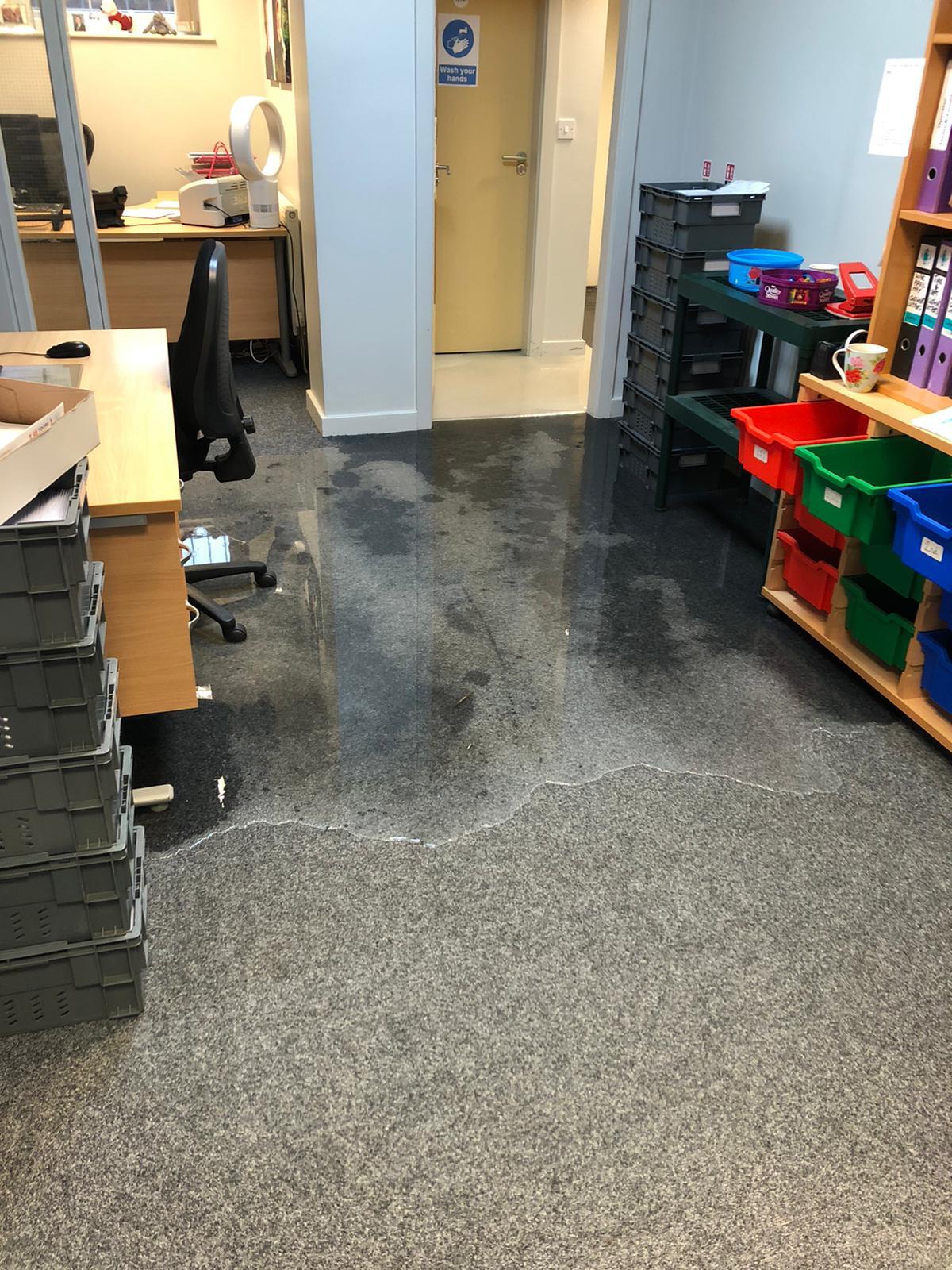 Water started to stream into the GB Tours office from the back door