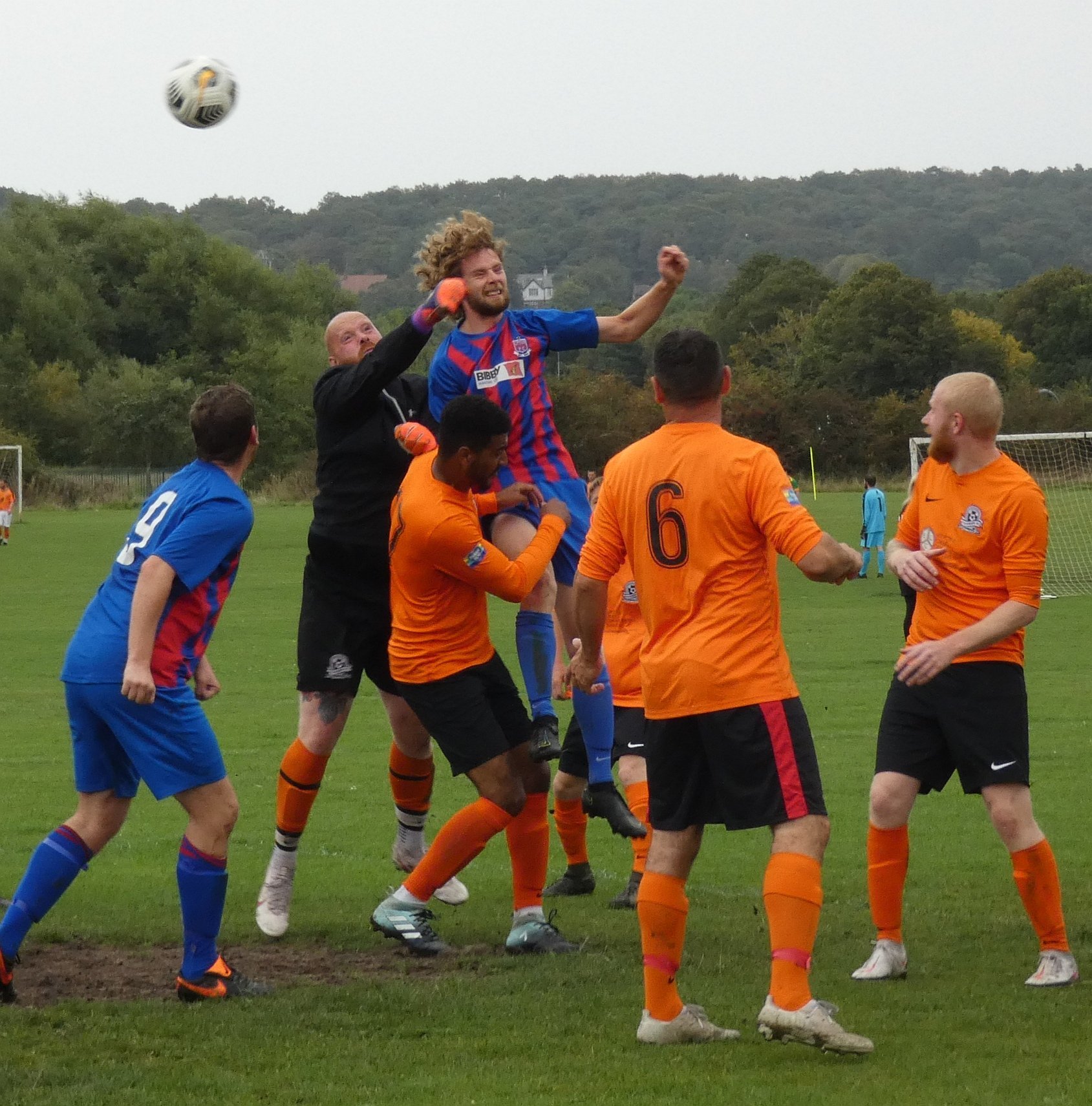 FC Telegraphs goalkeeper tries to punch clear another ball into the box from Upton. Photo: Bob Shaw