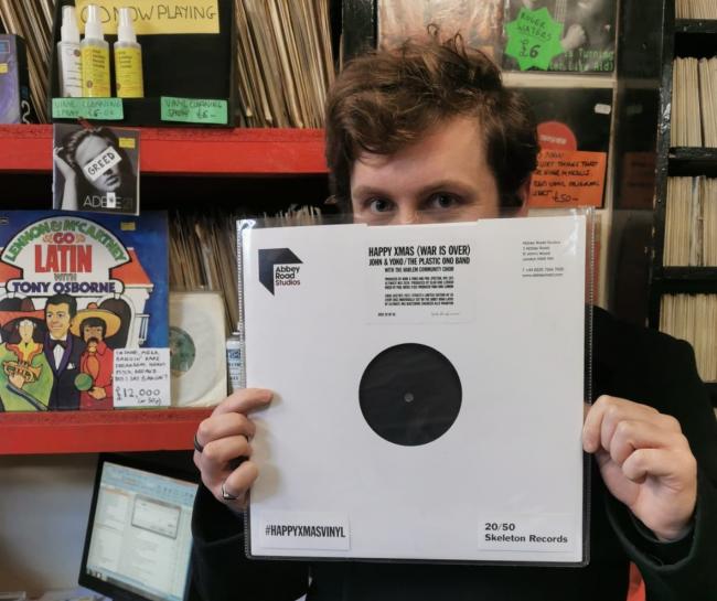 Ben Savage, of Skeleton Records, with John Lennon's rare vinyl