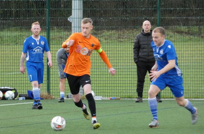 Action from the cup match between Rivacre FC (orange) and Beechwood SC. Photo: Bob Shaw