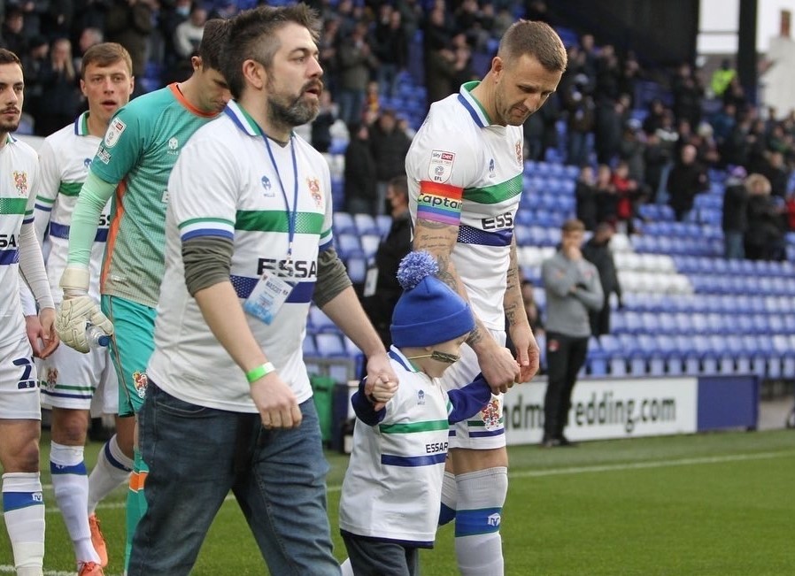 Nate and Phil lead Tranmere out against Leyton Orient, flanked by captain Peter Clarke. Photo: Tranmere Rovers