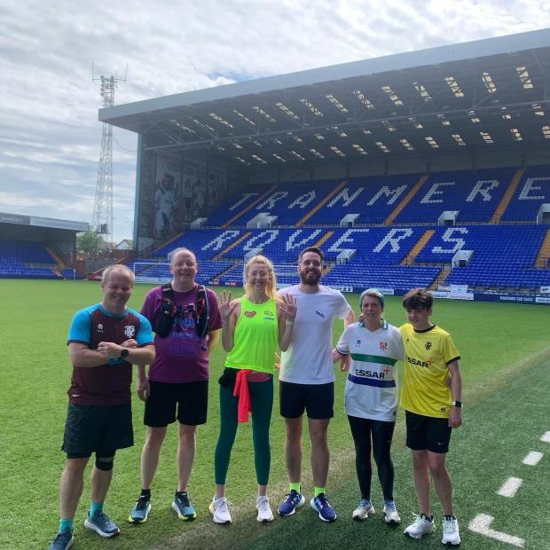 Wirral Globe: Jennifer and Tranmere fans at Prenton Park after completing the 10th run