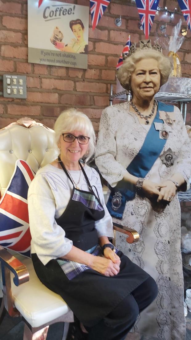 Wirral Globe: Owner of Fleur Ashley Tea Room in Wallasey Village, Ami Jones, with cardboard cut out of the Queen