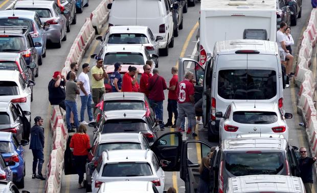 Wirral Globe: Liverpool supporters heading for the Champions League final in Paris wait amongst freight and holiday traffic queues at the Port of Dover in Kent (Gareth Fuller/PA)