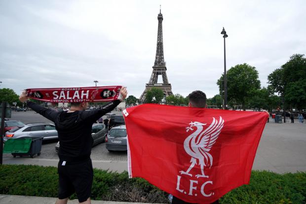 Wirral Globe: Liverpool fans pose for a photo in front of the Eiffel Tower (Peter Byrne/PA)