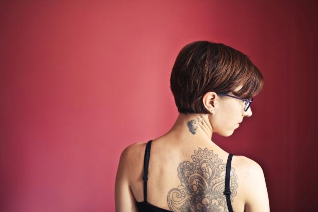Wirral Globe: A woman with back tattoos (Canva)