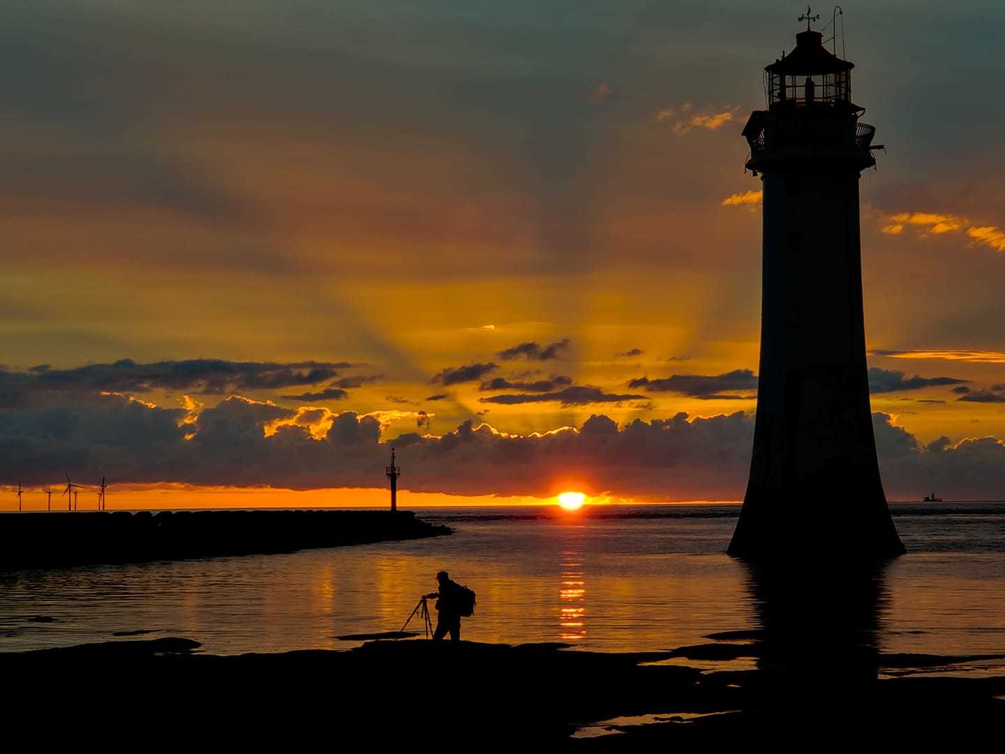 New Brighton lighthouse at sunset by Tony Crawford